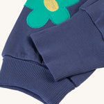 A look at the adjustable ankle cuffs on the Frugi Perrin Parsnip Jogger - Navy Blue/Flowers