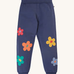 Frugi Perrin Parsnip Jogger - Navy Blue/Flowers. A navy blur fabric, with colourful flower appliques