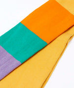 Frugi GOTS 100% organic cotton 2 pack tights showing a close up of the pastel rainbow striped design