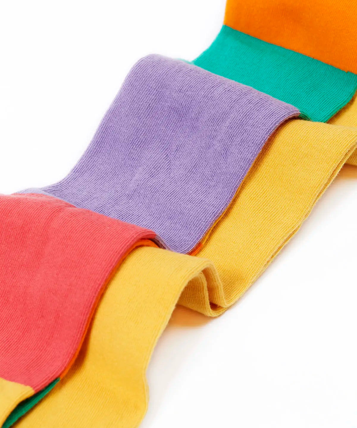Frugi GOTS 100% organic cotton 2 pack tights in yellow and a pastel rainbow striped design laid on top of eachother