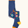 Frugi GOTS 100% organic cotton kids tights in navy with a floral resign on the lower leg, orange toe and yellow heel panel