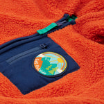 A closer look at the chest pocket and Get Outside patch