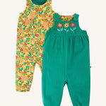 Frugi Lacey Reversible Dungaree - Iguana/Autumn Friends. One side is green with 3 flower appliques, and the other is a yellow floral and rabbit print