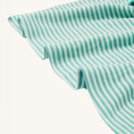 A closer look at the dress skirt and stripe design on the Frugi Dolcie Dress - Moss Stripe/Puffin Rainbow