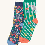 Frugi Frill Socks 2 Pack - Get Outside. Featuring flowery 'Get Outside' designs, one pair comes in navy with a flower repeat print, and the stripy green pair features and adorable grey cat