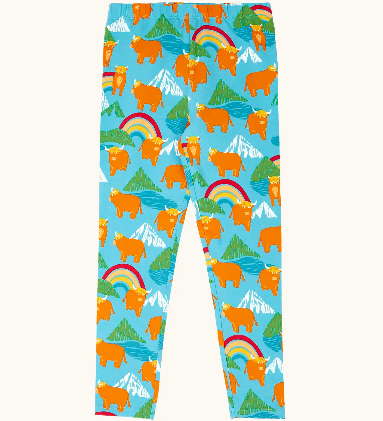 Frugi GOTS 100% organic cotton libby leggings in light blue with a repeating highland cow and mountain print. Features an elasticated waist band for easy wear