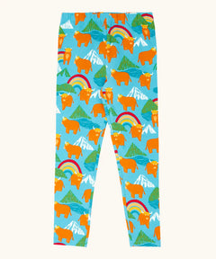 Frugi GOTS 100% organic cotton libby leggings in light blue with a repeating highland cow and mountain print. Features an elasticated waist band for easy wear