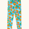 Frugi GOTS 100% organic cotton libby leggings in light blue with a repeating highland cow and mountain print. Features an elasticated waist band for easy wear