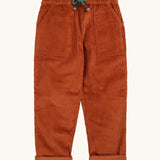 Frugi GOTS organic cotton children's corduroy trousers in rust brown with front pockets and a green waist drawcord 
