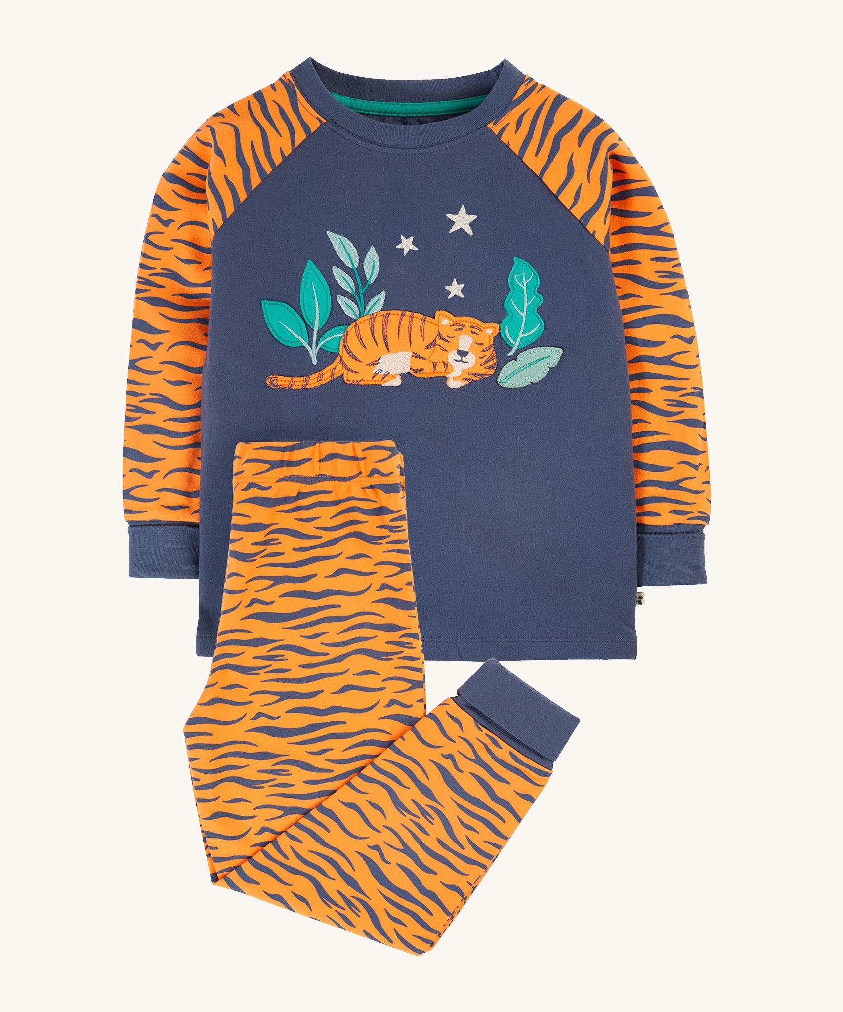 Frugi Jamie Jim Jams - Sleeping Tiger. With an orange tiger print design on the sleeves and a super cute tiger applique on the front