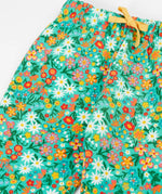 Frugi GOTS 100% organic cotton snuggle joggers in light green with a floral design and a elasticated waistband with drawcord