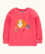 Frugi GOTS 100% organic cotton kids long sleeve top in pink with a playful guinea pig applique on the front