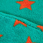 A closer look at the green fleece and orange stars on the Frugi Cosy Ted Snuggle Suit - Bonfire Stars