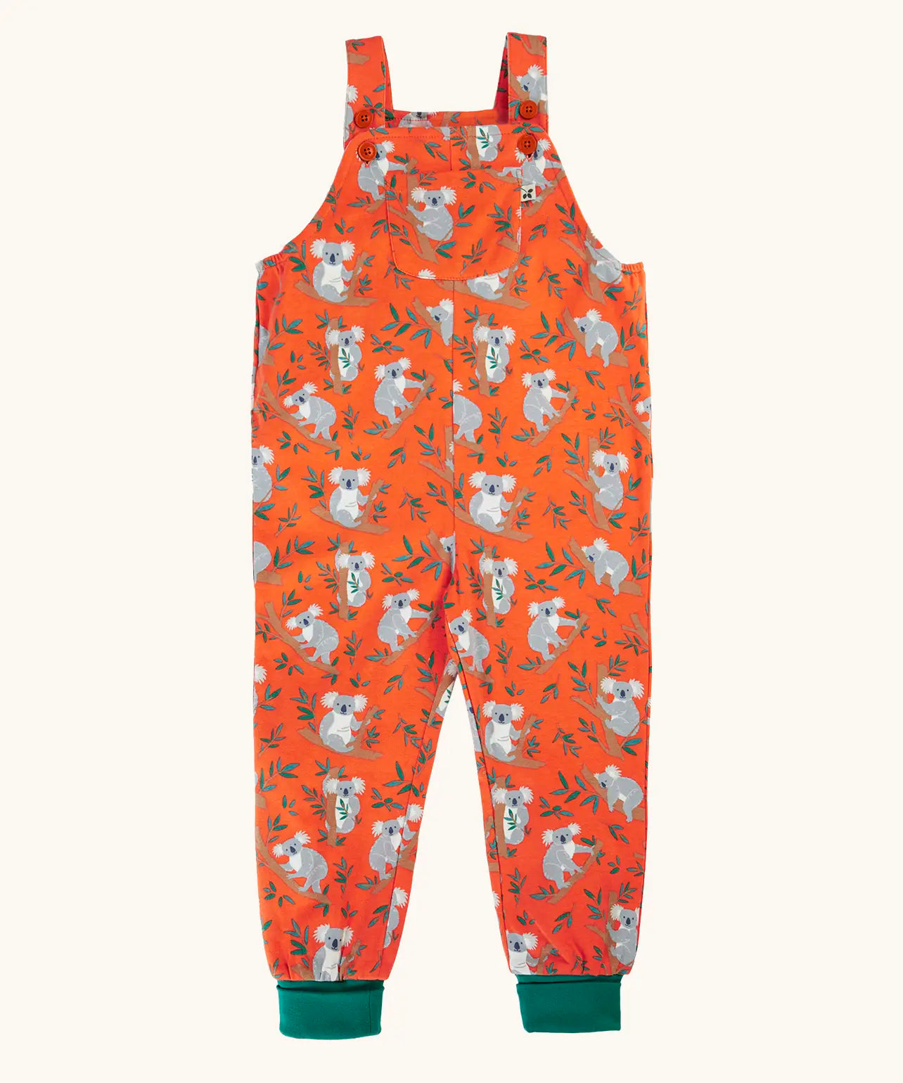 Frugi parsnip GOTS organic cotton dungaree in salamander orange with repeating koala prints, turquoise fold up leg cuffs and a pouch pocket