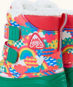 Side of Frugi out and about snow boots in fun frenzy showing a repeating bright pattern design, velcro fasteners and ankle padding 
