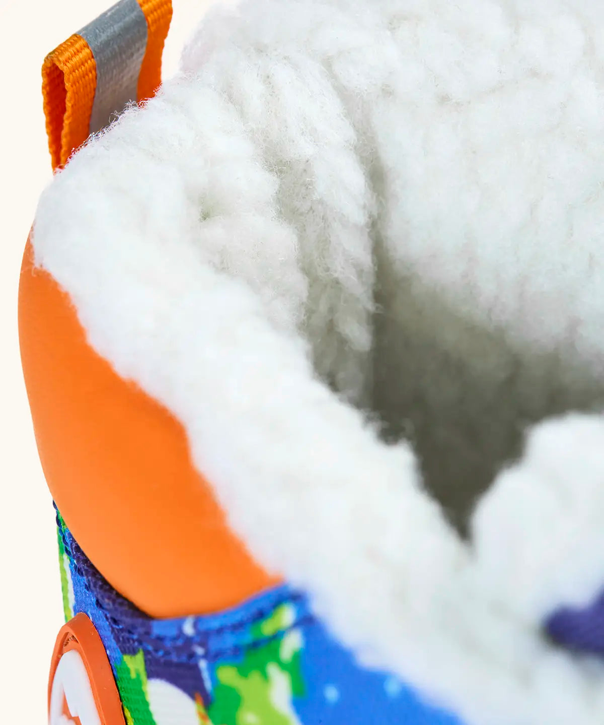 Frugi out and about snow boots in starry slopes showing close up of the fleece inner lining
