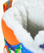 Frugi out and about snow boots in starry slopes showing close up of the fleece inner lining
