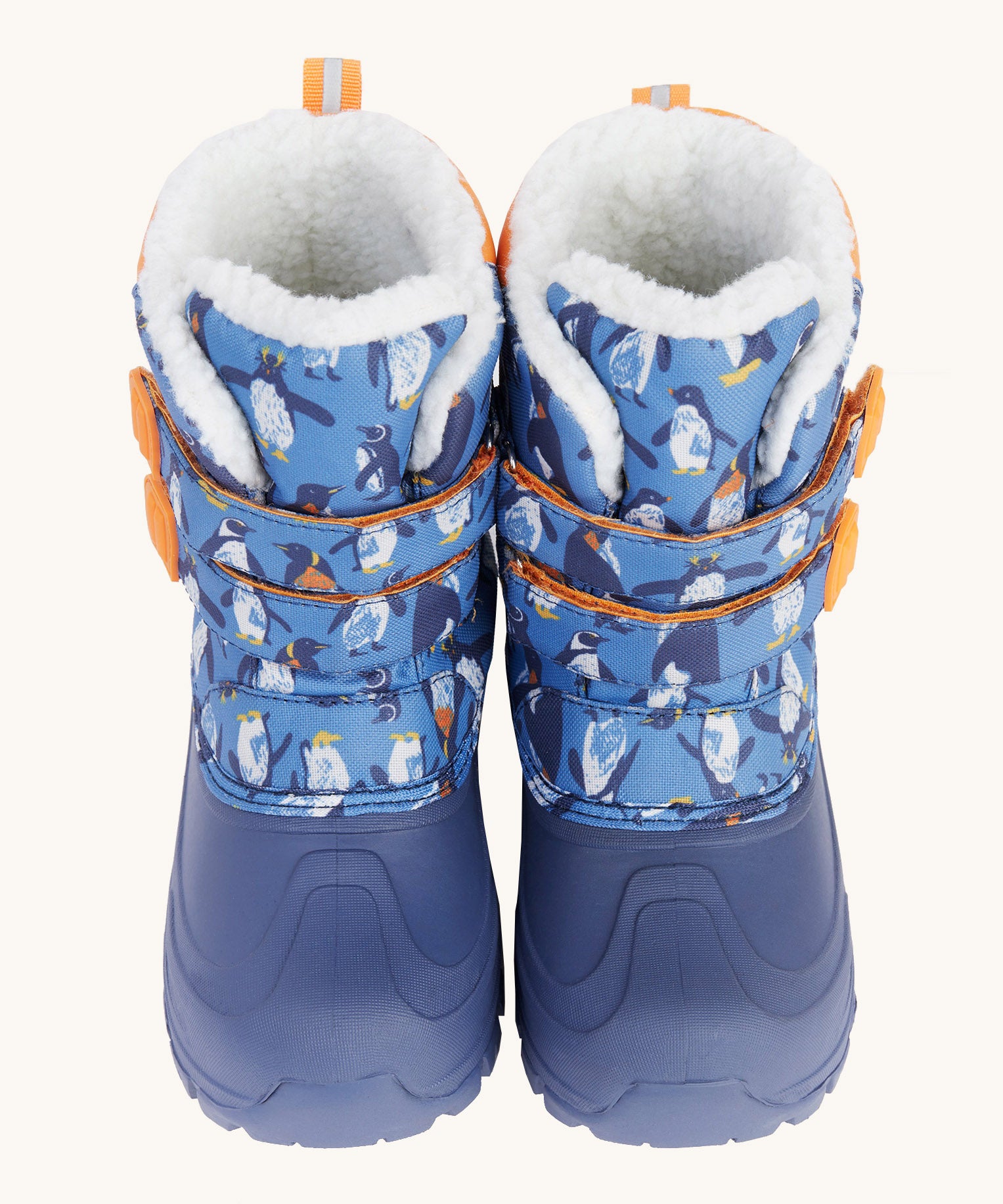 A close up of the Frugi out and about snow boots in penguin waddle showing the blue toe protector cap and velcro fastener detail.