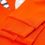 A closer look at the wrist cuffs on the Frugi Owen Top - Bonfire/Lemur