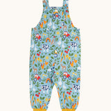Frugi organic cotton dungarees. In a light blue and yellow trim with a  repeated farm theme print. Features button fasteners and a small pocket on the front
