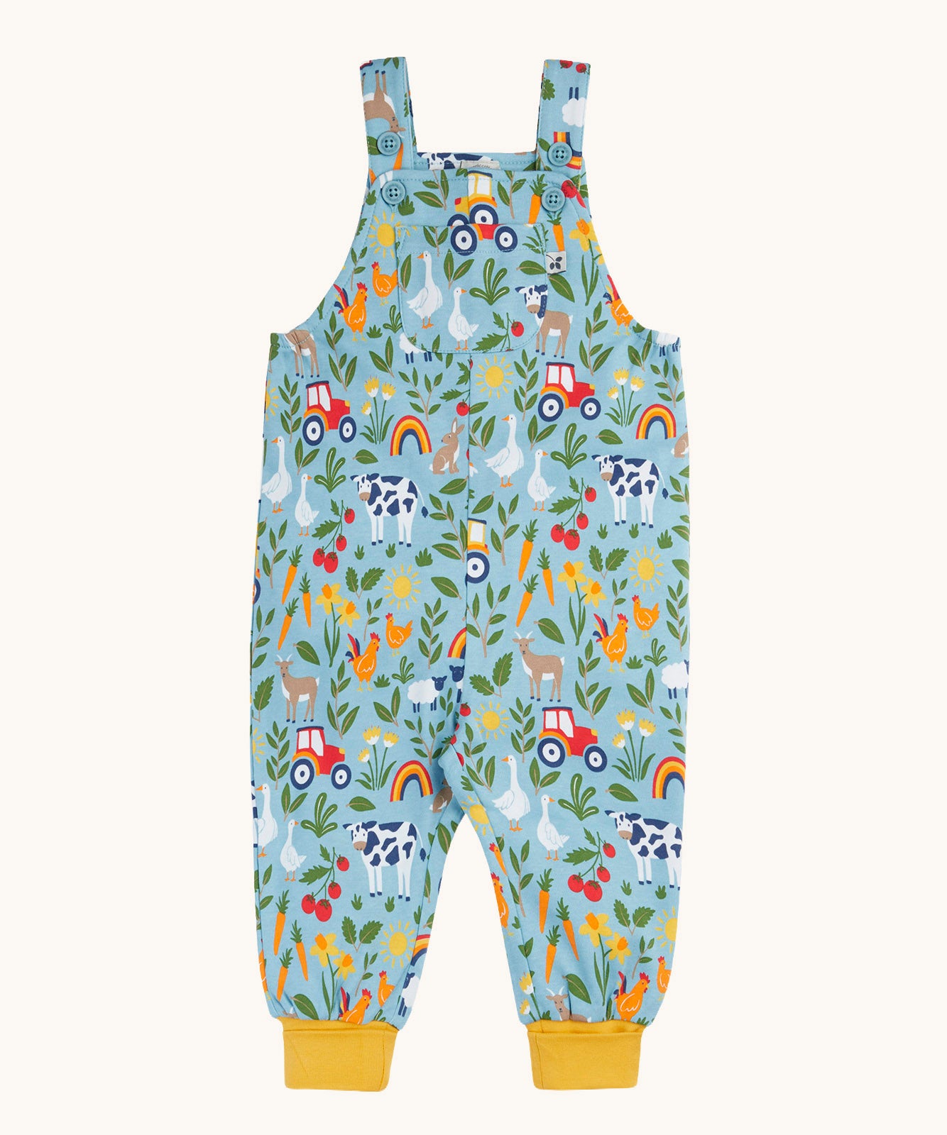 Frugi organic cotton dungarees. In a light blue and yellow trim with a  repeated farm theme print. Features button fasteners and a small pocket on the front