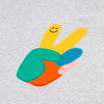 A closer look at the peace applique on the front of the Frugi Owen Top - Grey Marl/Peace