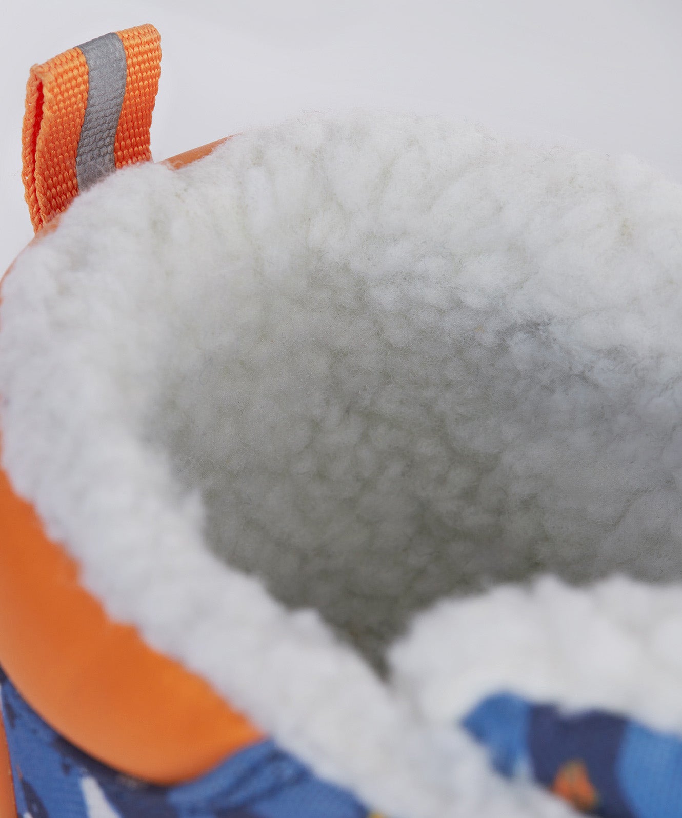 A close up of the Frugi out and about snow boots in penguin waddle showing the white fleece inner detail