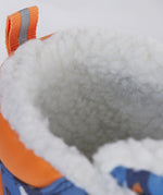 A close up of the Frugi out and about snow boots in penguin waddle showing the white fleece inner detail
