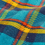 Frugi's Penhale parka coat in a blue red and yellow tartan check showing a close up of the water beading 