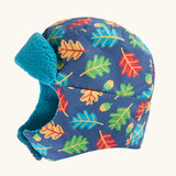 Frugi kids navy playtime trapper hat with a repeating leaf and acorn design and aqua fleece inner lining.