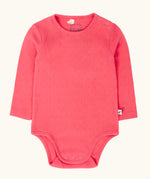 Frugi baby GOTS organic cotton pointelle body in rhubarb pink. features popper fasteners on the shoulder and gusset for easy dressing