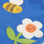 A closer look at the bee and flower applique on the Frugi Polly Pinafore Outfit - Blue Tang/Retro Happy. The appliques' also include some embroidery detail like the black stripes on the bee, and the leaf vein pattern on the flower. The applique's are on the blue fabric of the dress