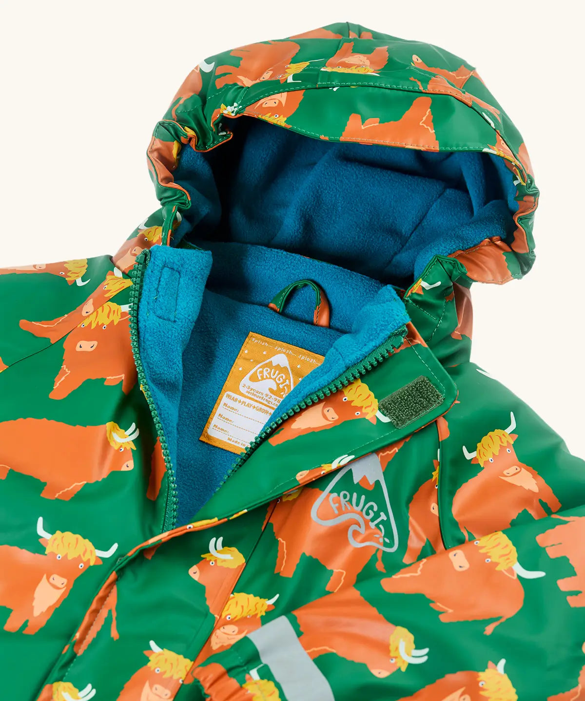 Frugi Highland cow waterproof puddle buster all in one hooded suit laid flat showing the blue fleece inner and zip fastener