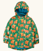 Frugi waterproof puddle buster coat in highland grazing. A green hooded coat with a repeating Highland cow design, side pockets and a blue fleece inner