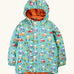 Frugi waterproof puddle buster coat in terrific tractors A aqua hooded coat with a repeating tractor design, side pockets and a orange fleece inner