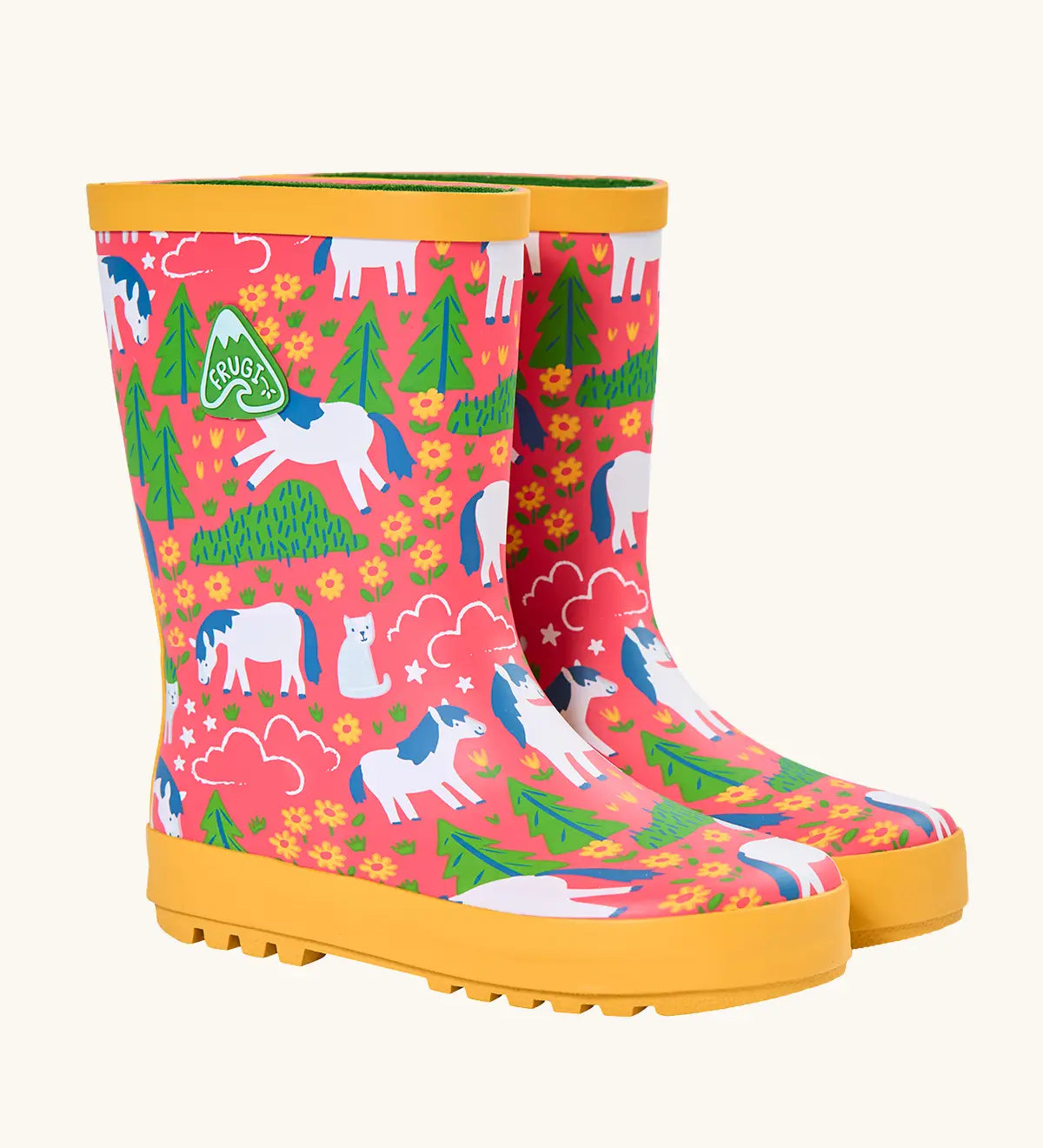 Frugi natural rubber, waterproof puddle buster wellingtons in pink with a repeating cat and pony design and yellow sole