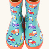 Front of Frugi puddle buster wellington boots showing the repeating tractor design on aqua natural rubber material