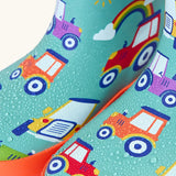 Frugi natural rubber, waterproof puddle buster wellingtons in terrific tractor design showing water beading 