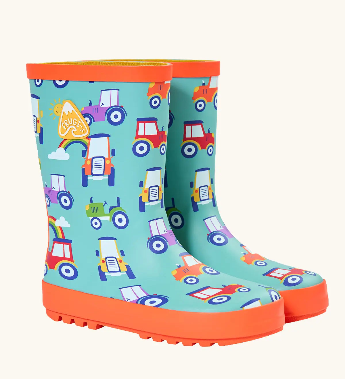 Frugi natural rubber, waterproof puddle buster wellingtons in aqua with a repeating tractor design and orange sole
