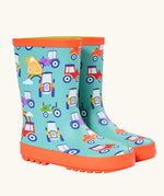 Frugi natural rubber, waterproof puddle buster wellingtons in aqua with a repeating tractor design and orange sole