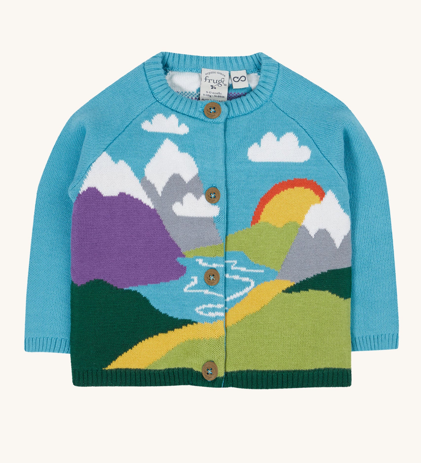 Frugi kid reva knitted cardigan in blue/mountain scene available at Babipur. A GOTS organic cotton soft knitted cardigan in light blue with a mountain scene . Features button fasteners