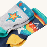 Both pairs of Frugi Little Socks - Stars 2 Pack. The grey pair is on top, with the navy pair below