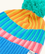 Frugi GOTS organic cotton bobble hat laid flat showing pastel rainbow stripe design