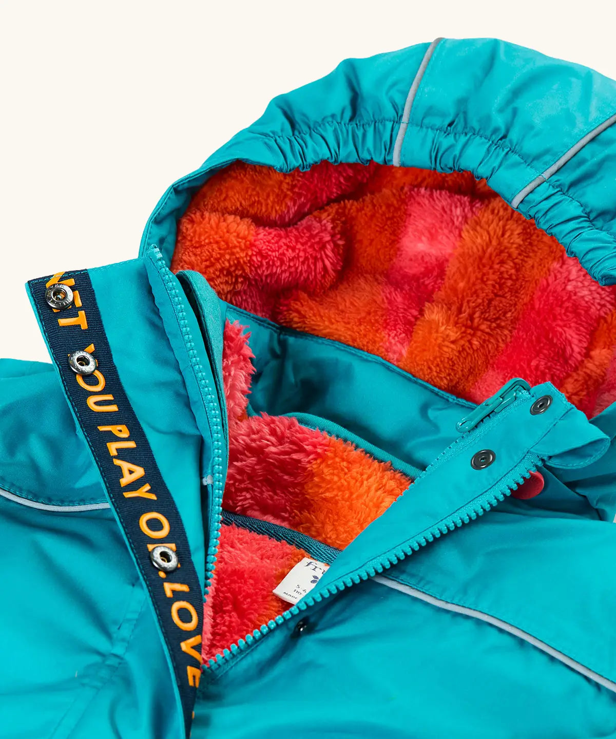 Frugi kids 3 in 1 rambler coat in boat blue/rhubarb check laid flat showing the pink and orange check fleece inner lining on the hood