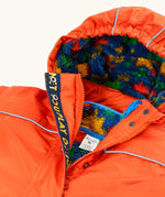 Frugi kids 3 in 1 rambler coat in fire upon a star laid flat showing the navy fleece with multicoloured stars inner lining on the hood