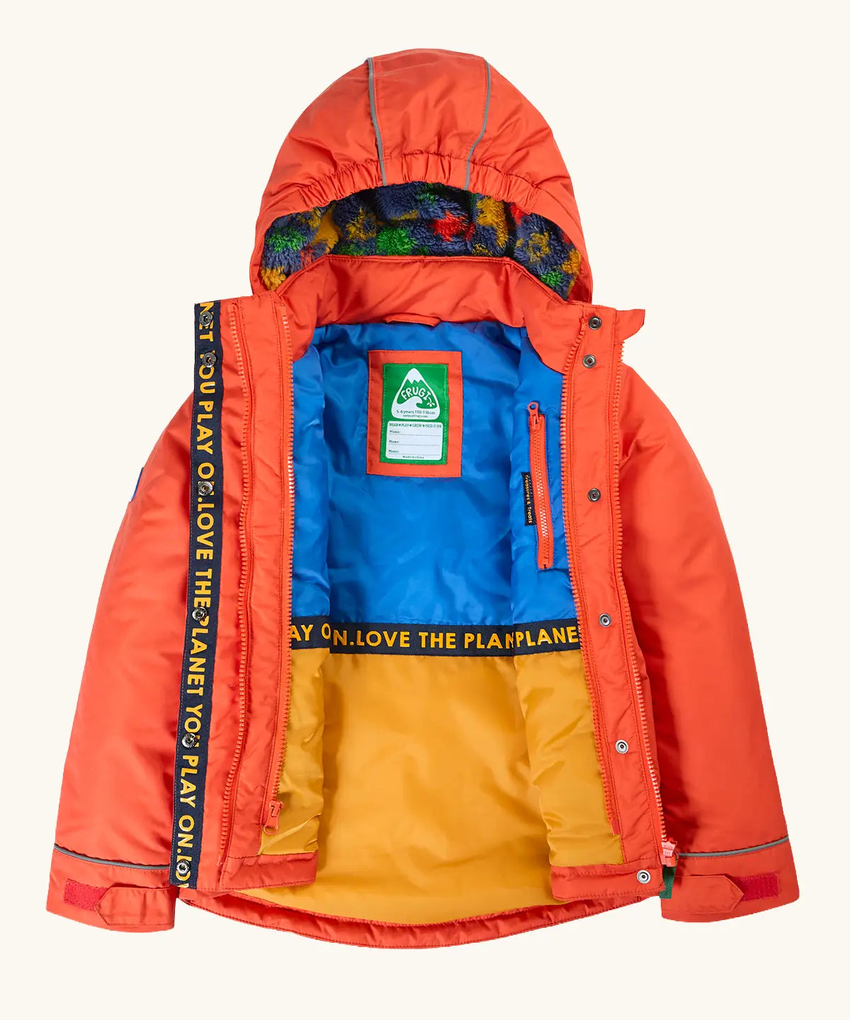 An open Frugi kids 3 in 1 rambler coat in fire upon a star showing the full length zip, fleece inner lining on the hood and a zipped pocket on the inner chest