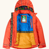 An open Frugi kids 3 in 1 rambler coat in fire upon a star showing the full length zip, fleece inner lining on the hood and a zipped pocket on the inner chest