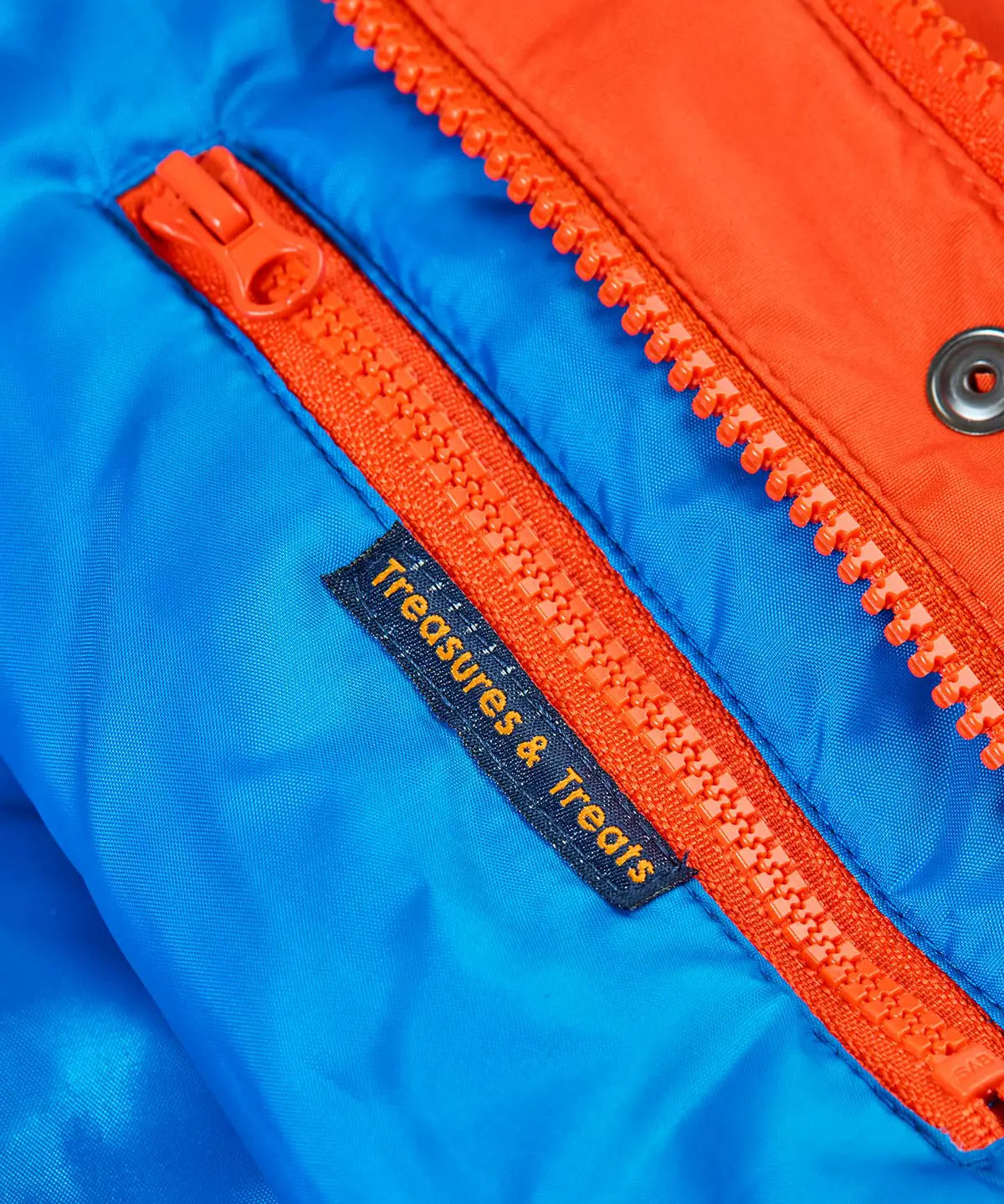 Frugi kids 3 in 1 rambler coat in fire upon a star showing the inside zipped pocket detail