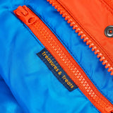 Frugi kids 3 in 1 rambler coat in fire upon a star showing the inside zipped pocket detail