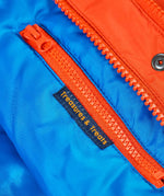 Frugi kids 3 in 1 rambler coat in fire upon a star showing the inside zipped pocket detail